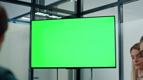 business colleagues working mockup screen tv. partners watching presentation