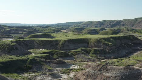 Low-aerial-pass-over-badlands-in-Alberta,-Canada