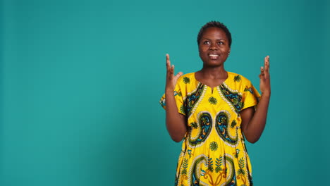 Natural-gorgeous-woman-feeling-positive-and-praying-in-studio