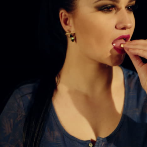 young woman taking pills. vitamin, anesthetic, antibiotic.