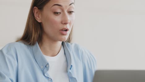 woman looking at laptop screen