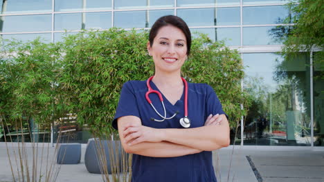 hispanic female doctor wearing scrubs