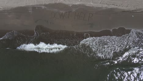 help letter written on the beach