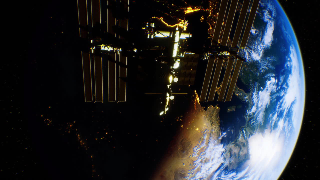International space station orbits earth at night displaying city lights