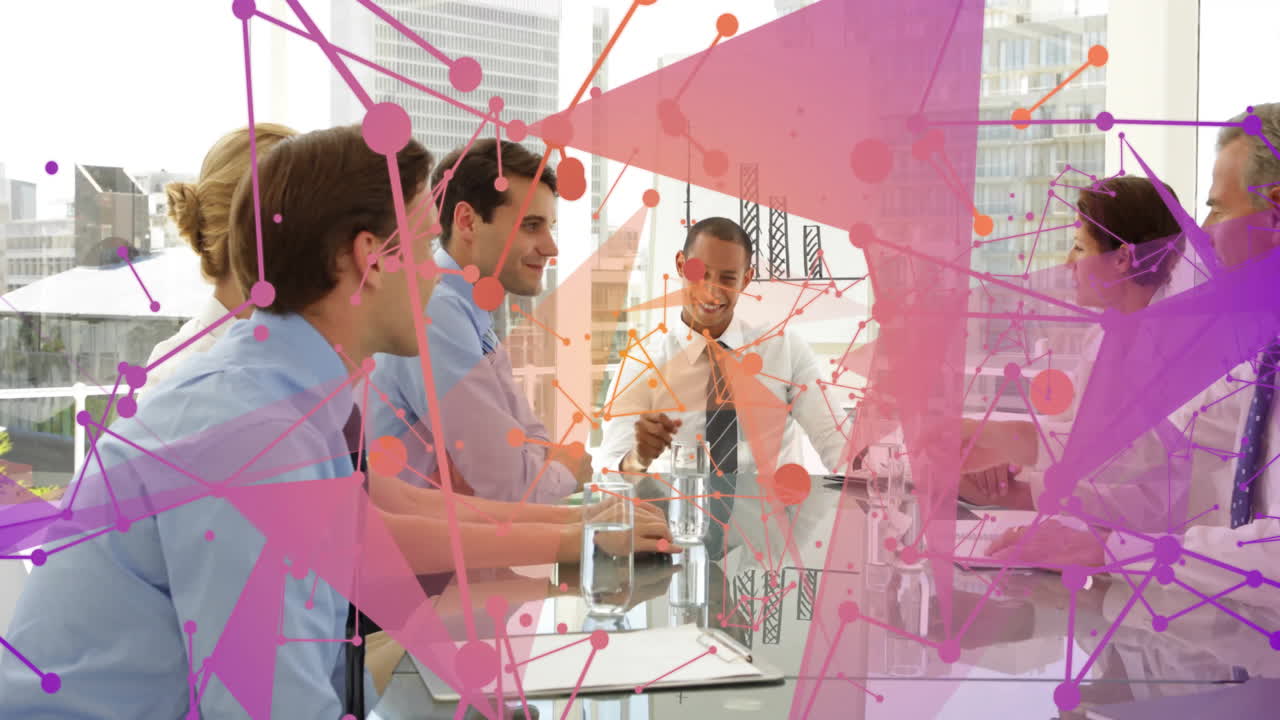 In business meeting, colorful network connections overlaying scene with team discussing