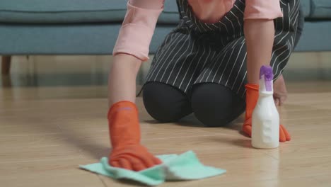 woman cleaning wooden floor