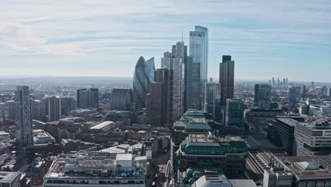 long aerial dolly back london drone shot of skyscrapers