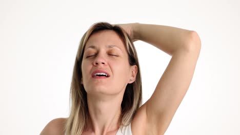 woman checking her underarm for freshness