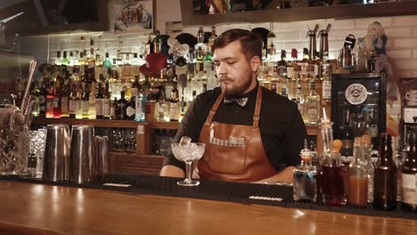 bartender preparing cocktails at a vintage bar