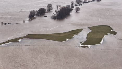 landscape and farm land heavily flooded around river waal, woudrichem