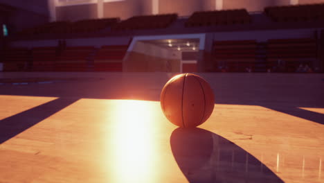 basketball on court at sunset