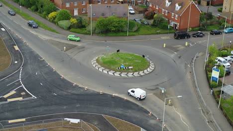 Static-aerial-view-of-vehicles-using-a-newly-constructed-roundabout-in-the-UK