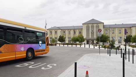 bus arriving at the train station in a french city