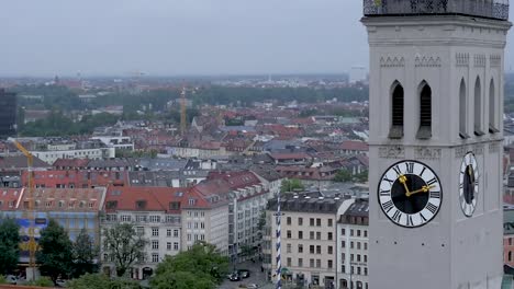 aerial view of munich cityscape with church tower and clock