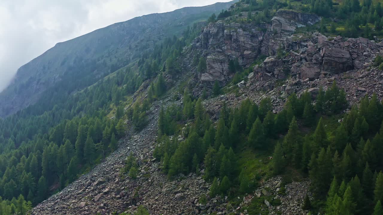 Upward flight on the Grossglockner High Alpine Road with a view of rocks, 4k