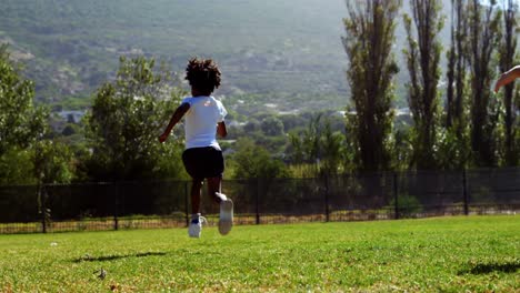 children running in park during race