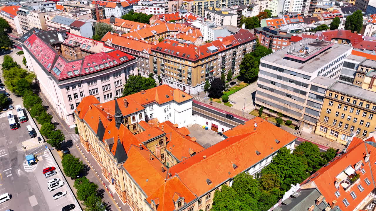 Old buildings with orange roofs in the historical center of the city. Drone footage above the cityscape of Bratislava, Slovakia.