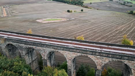 Aerial footage of the Penistone Viaduct a curved railway viaduct which carries the Railway over Sheffield Road and the River Don