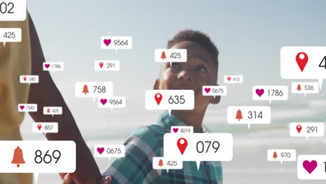on beach, child holding hand with animation of notifications and likes overlay