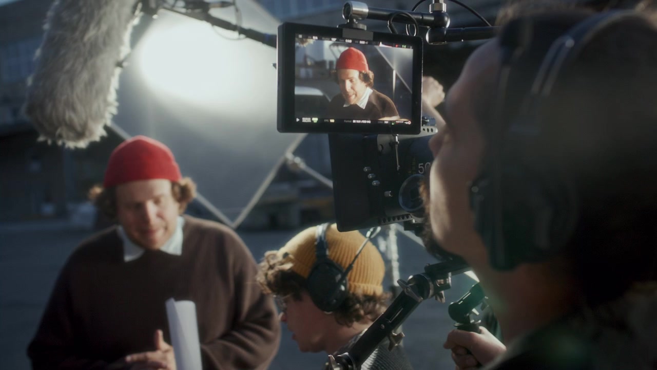 Camera Operator Reviewing Composition on Monitor during Outdoor Shoot