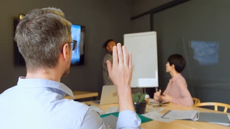 Business-executives-discussing-over-whiteboard-in-conference-room-4k-