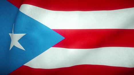 la bandera de puerto rico ondeando en el viento