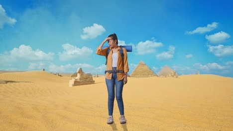 full body of asian female hiker with mountaineering backpack having a headache while traveling in pyramid of giza