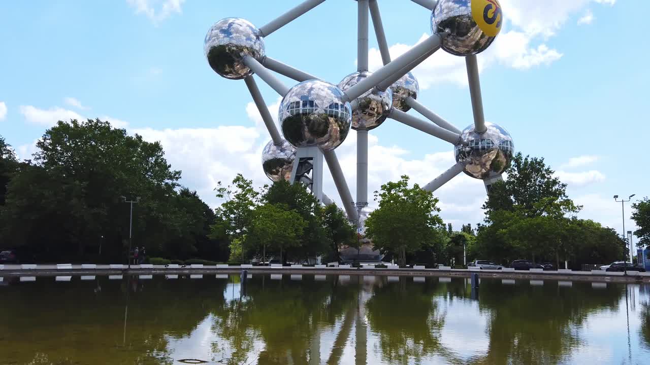 BRUSSELS, BELGIUM - JUNE 26, 2019: Close-up view of a reflection of the Atomium building in the water