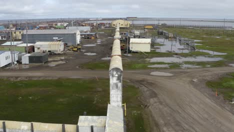 Aerial-Drone-shot-Flying-over-Flooding-Climate-Research-Center-in-the-Thawed-Permafrost-Tundra-near-Barrow-Alaska