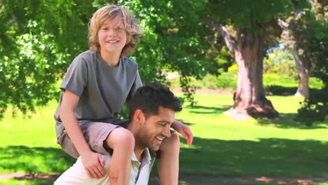 Young-man-playing-with-his-son