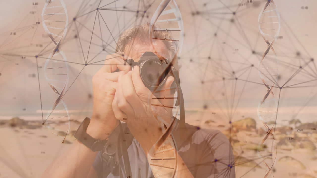 Male photographer capturing rocky beach, overlaying DNA helix and network nodes for tech industry