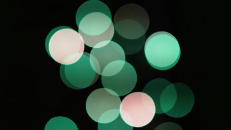 multicolored blinking bokeh on a black background.