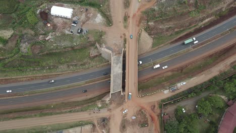 Aerial-View-of-Road-Traffic-and-Bridge-Overpass-in-Kibera-Neighborhood,-Nairobi-Kenya