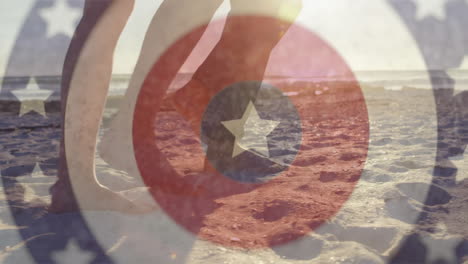walking on sandy beach, feet with animation of patriotic star and circle design