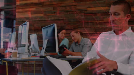 People working at office desks with digital network animation overlay