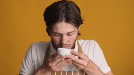 Caucasian-man-in-front-of-camera-on-yellow-background.