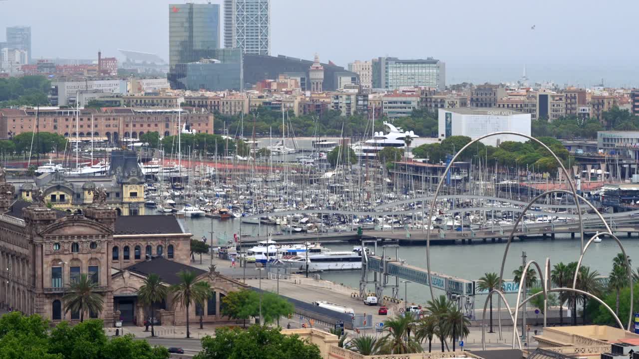 Aerial drone view of the Port Vell, the Columbus Monument and the Junta d'Obres del Port building in Barcelona, Spain