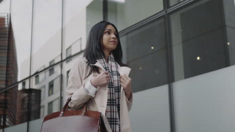 Businesswoman-walking-on-city-street