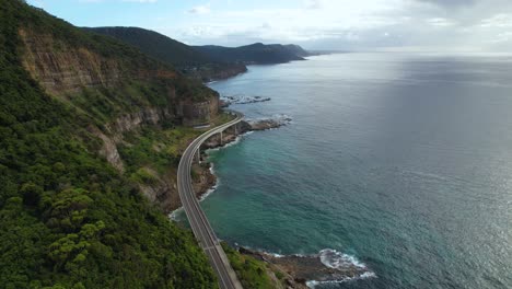 4k drone still drone video showing the vast ocean underneath the sea cliff road