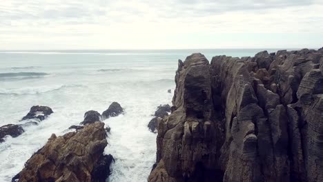 Drone-view-of-the-pancake-rocks-at-Dolomite-point,-Punakaiki,-New-Zealand