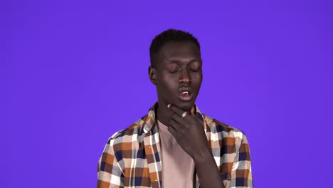 Portrait-young-man-has-and-idea,-pointing-with-finger-up-looking-up,-isolated-blue-wall-background.-Excited-man-with-problem