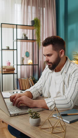 Freelancer-man-prepares-startup-project-for-presentation-finds-idea-using-laptop-at-home-office