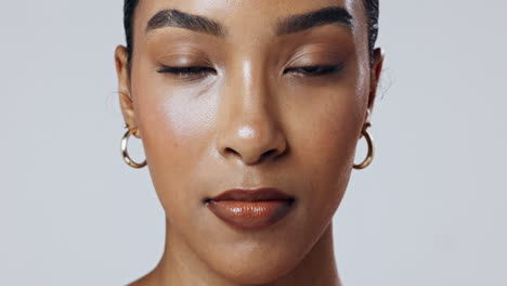 close-up portrait of a woman with closed eyes and natural makeup