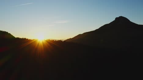 a drone rises over a silhouetted oclini and corno bianco