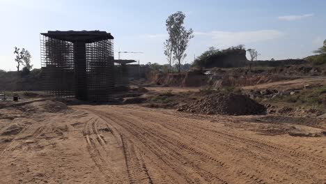 City-under-construction-flyover-with-residential-buildings-at-Bhusawal-Maharashtra-India,-Bridge-under-construction