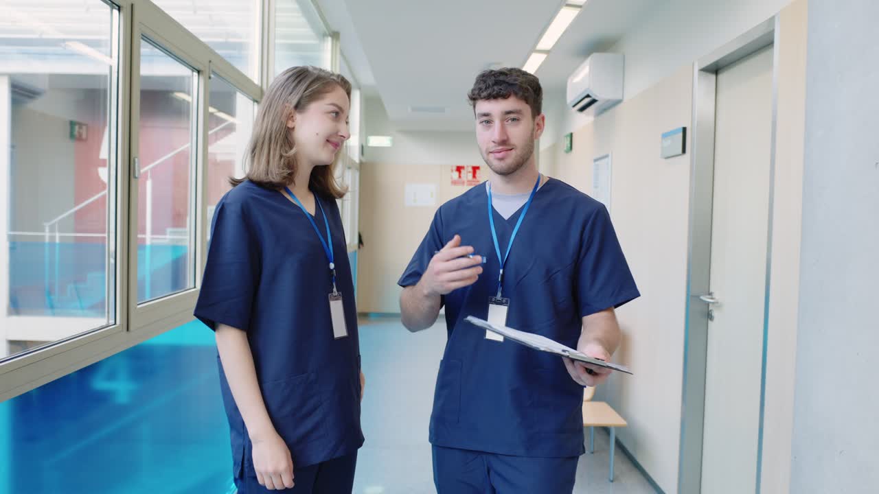 Medical staff discussing patient care in hospital hallway
