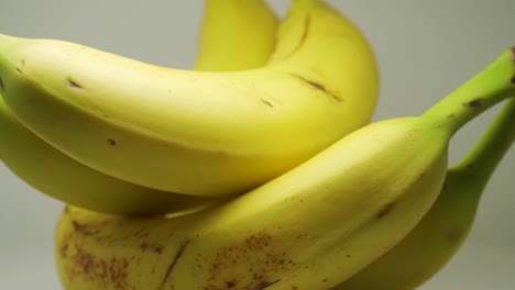 yellow ripe bananas on pure white background - close up shot