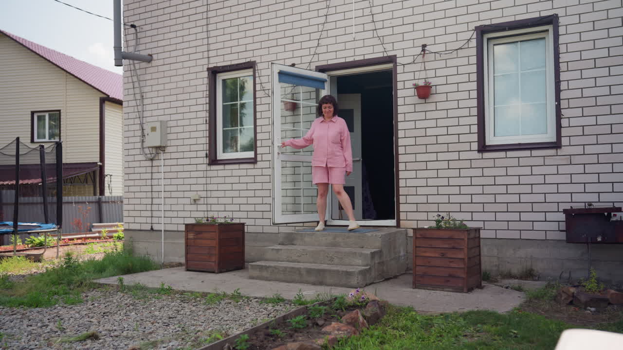 White Woman Watching Mixed Children At Doorstep, Arms Folded, Stern Expression, Kids Running Across Gravel, Pink Outfit, Suburban Fence, Open Door, Summer Chaos, Brief Confrontation