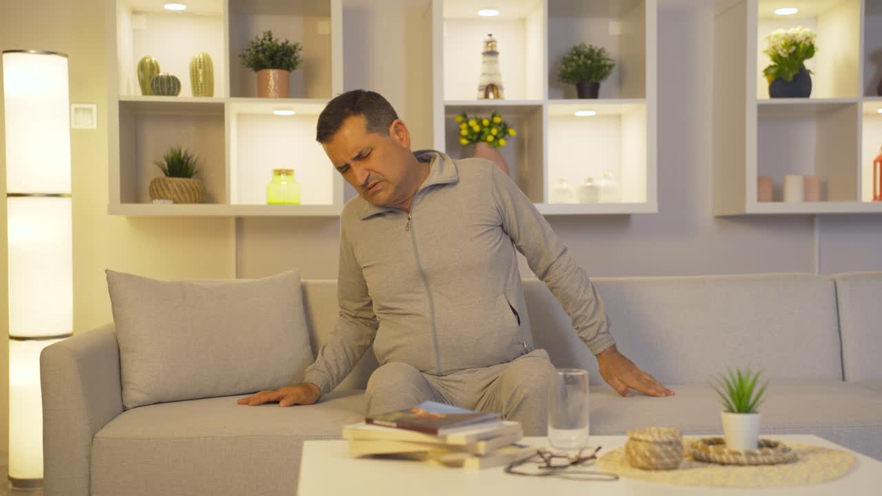 Sick man with back pains.