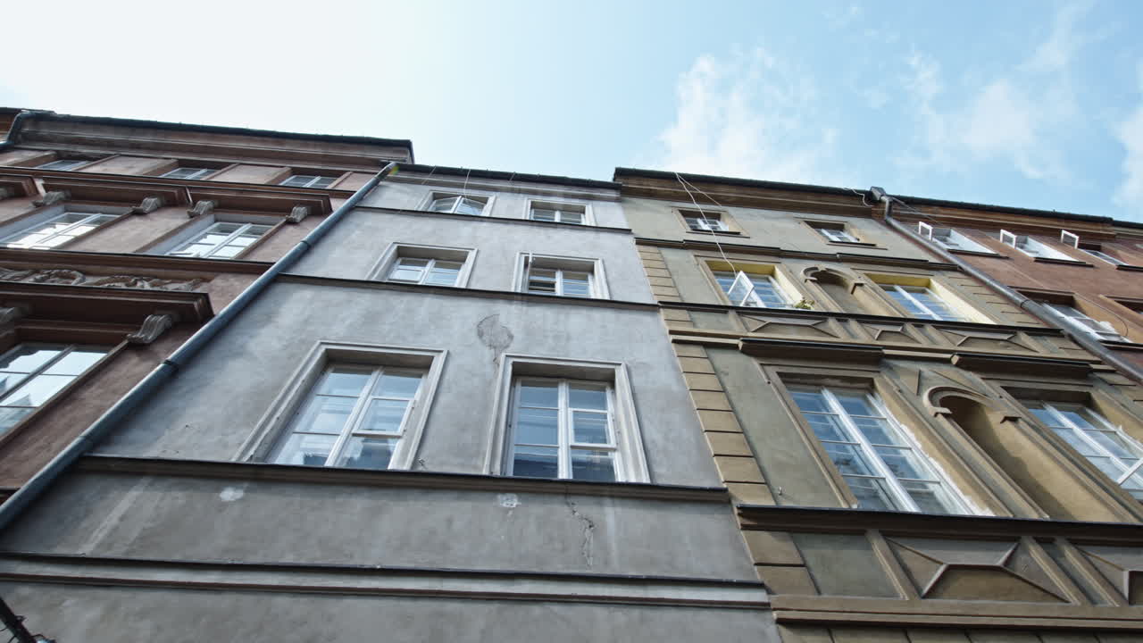 Old Town Warsaw, showcasing colorful, historic buildings with intricate windows and architectural details